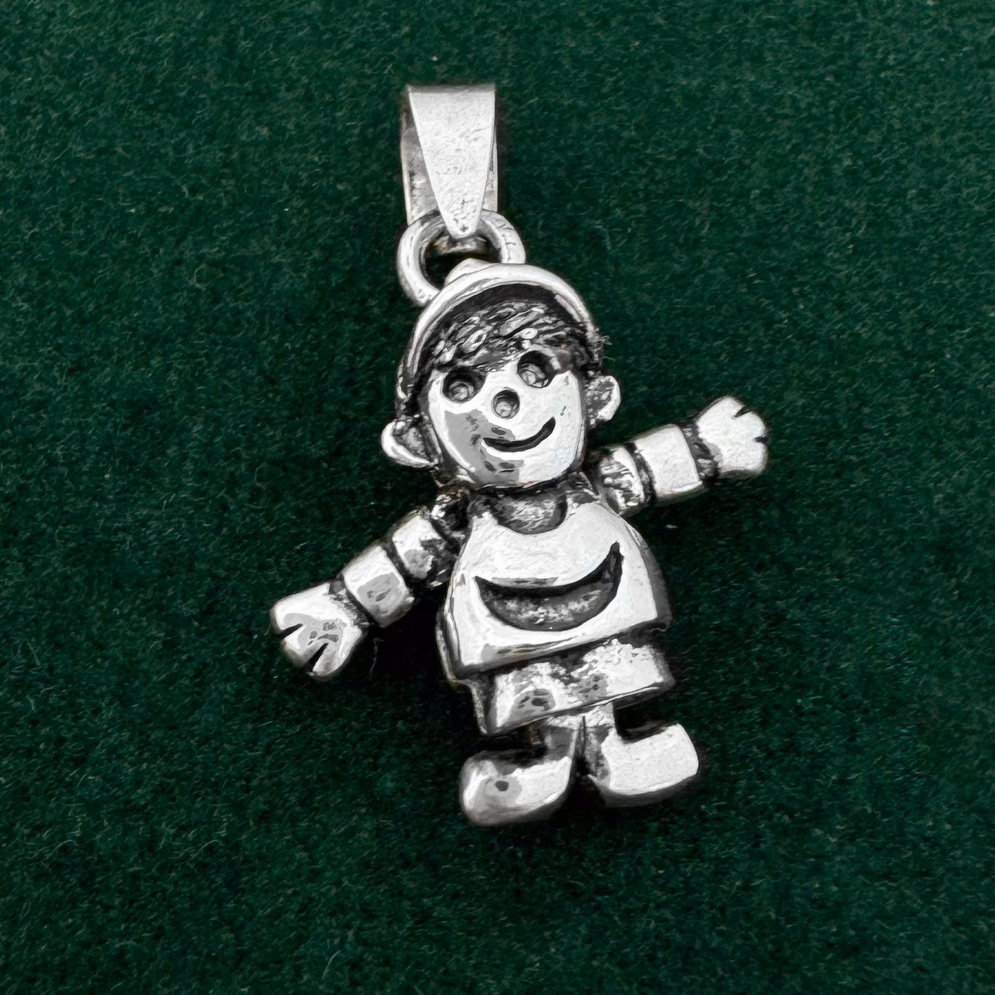 Dije niño articulado