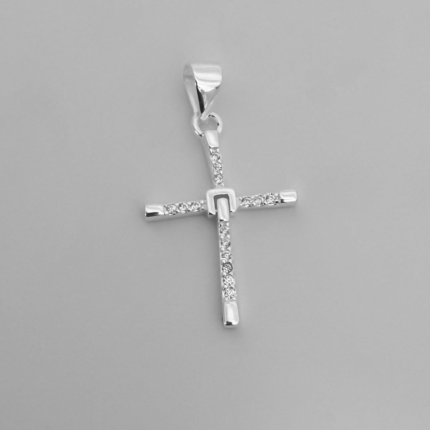 Dije cruz articulada pequeña