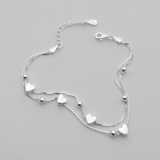 Pulsera doble Corazones