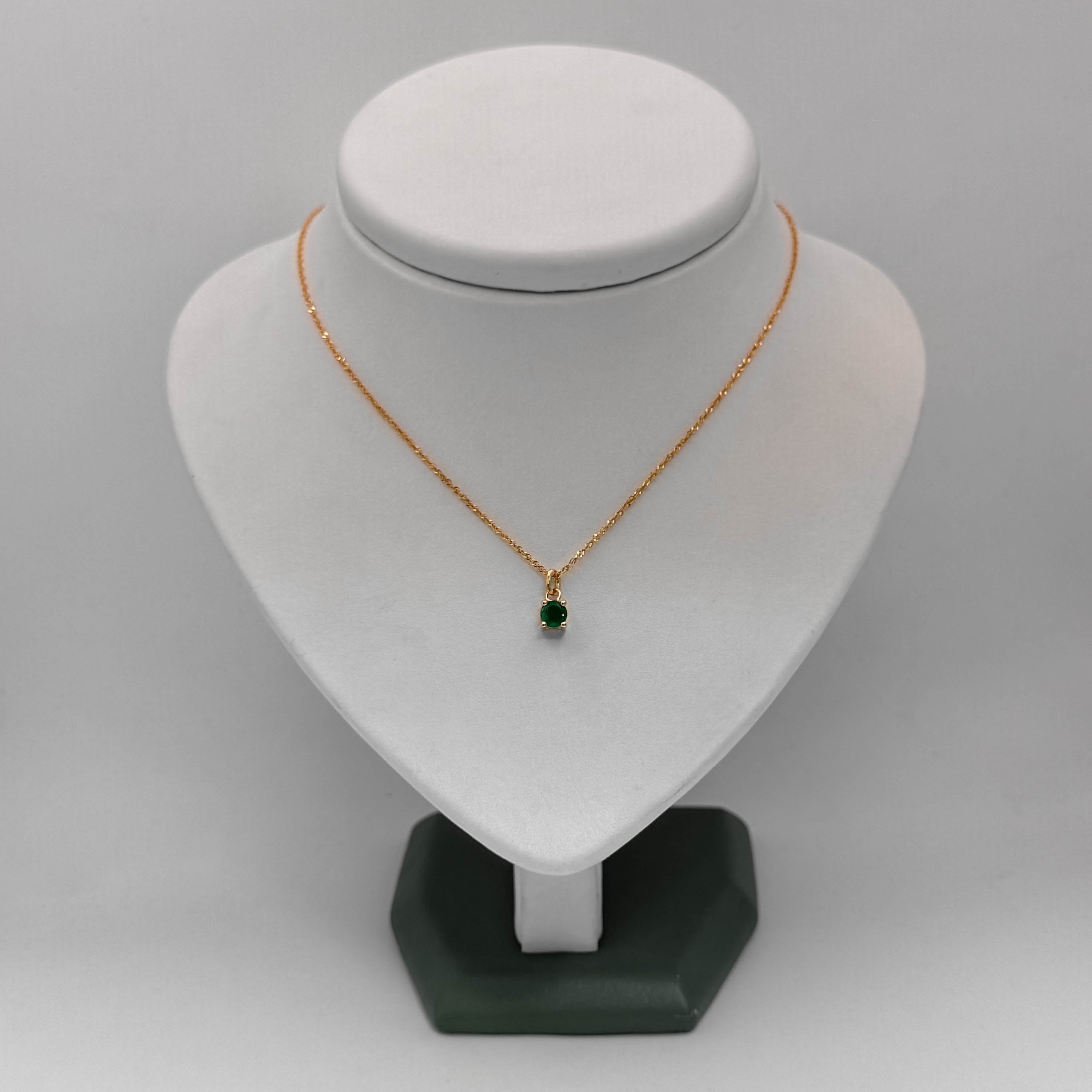 Dije Oro 18k y Esmeralda redonda