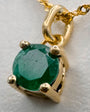 Dije Oro 18k y Esmeralda redonda