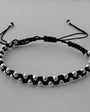 Pulsera negra tejida con esferas