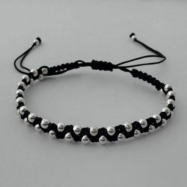 Pulsera negra tejida con esferas