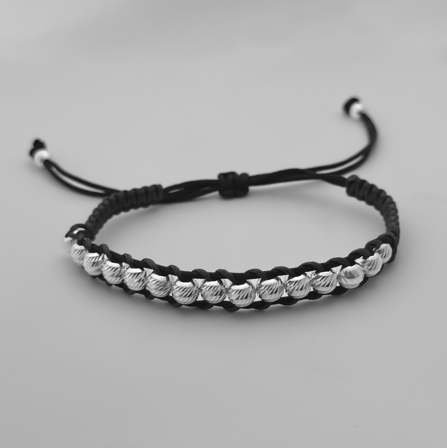 Pulsera Tejida Órbitas Negra