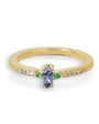 Anillo en oro con tanzanita, esmeralda y diamantes.