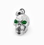Dije tridimensional de calavera en Plata Ley 925 con dos esmeraldas naturales brillantes engastadas en los ojos.