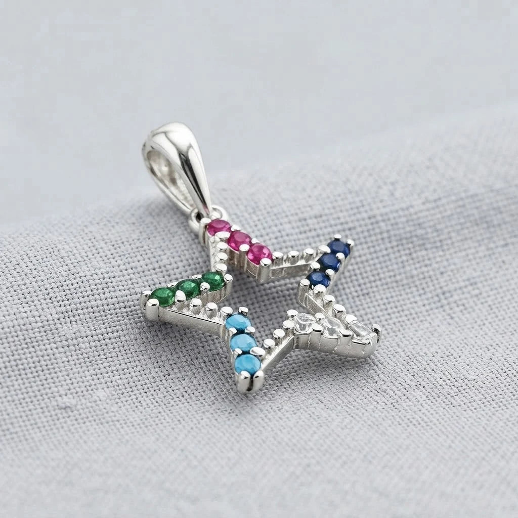 Dije de estrella calada de 15x14 mm en plata ley 925 con circones multicolor