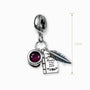 Dije con temática de escritor y circon rojo en plata ley 925.