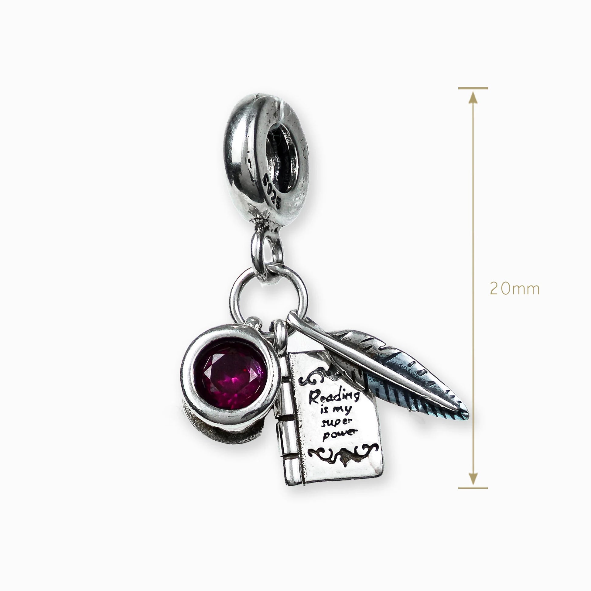 Dije con temática de escritor y circon rojo en plata ley 925.