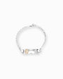 Pulsera de identidad infantil en plata ley 925 con placa lisa de 25 mm para grabado personalizado sobre fondo blanco.
