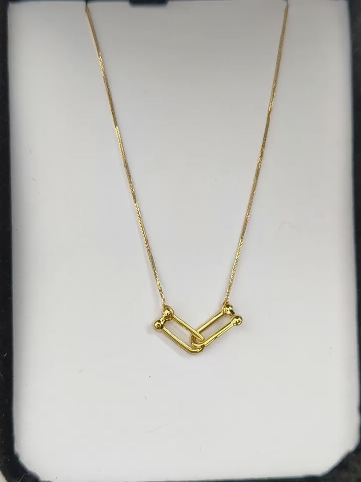 Cadena en oro 18K de tejido veneciano con dije nexo interconectado de 10x4 mm.
