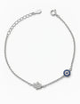 Pulsera en plata ley 925 con símbolos de ojo turco y mano de fátima decorada con circones.
