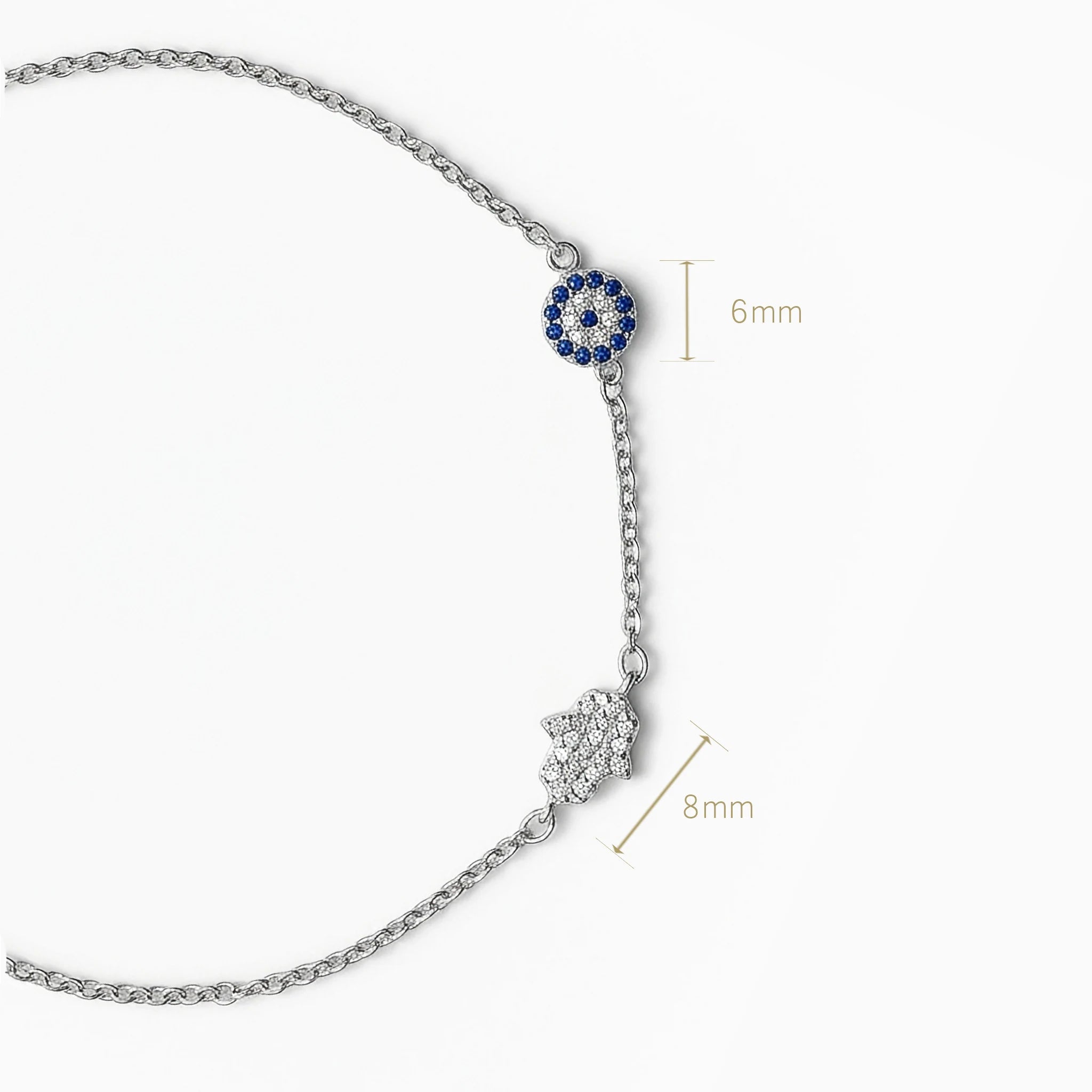 Pulsera en plata ley 925 con símbolos de ojo turco y mano de fátima decorada con circones.