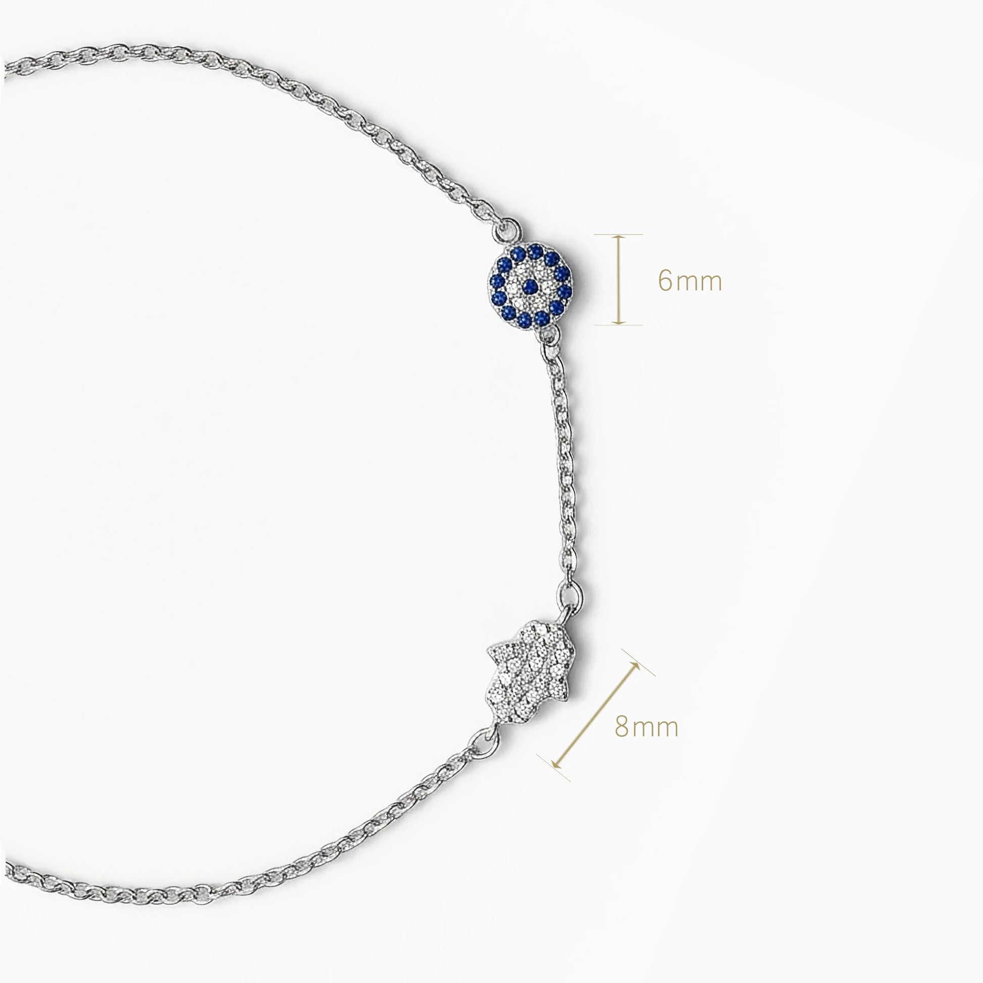 Pulsera en plata ley 925 con símbolos de ojo turco y mano de fátima decorada con circones.