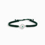 Pulsera tejida verde con dije de trébol en Plata Ley 925 y esmeralda central de Joyería Esterlina.