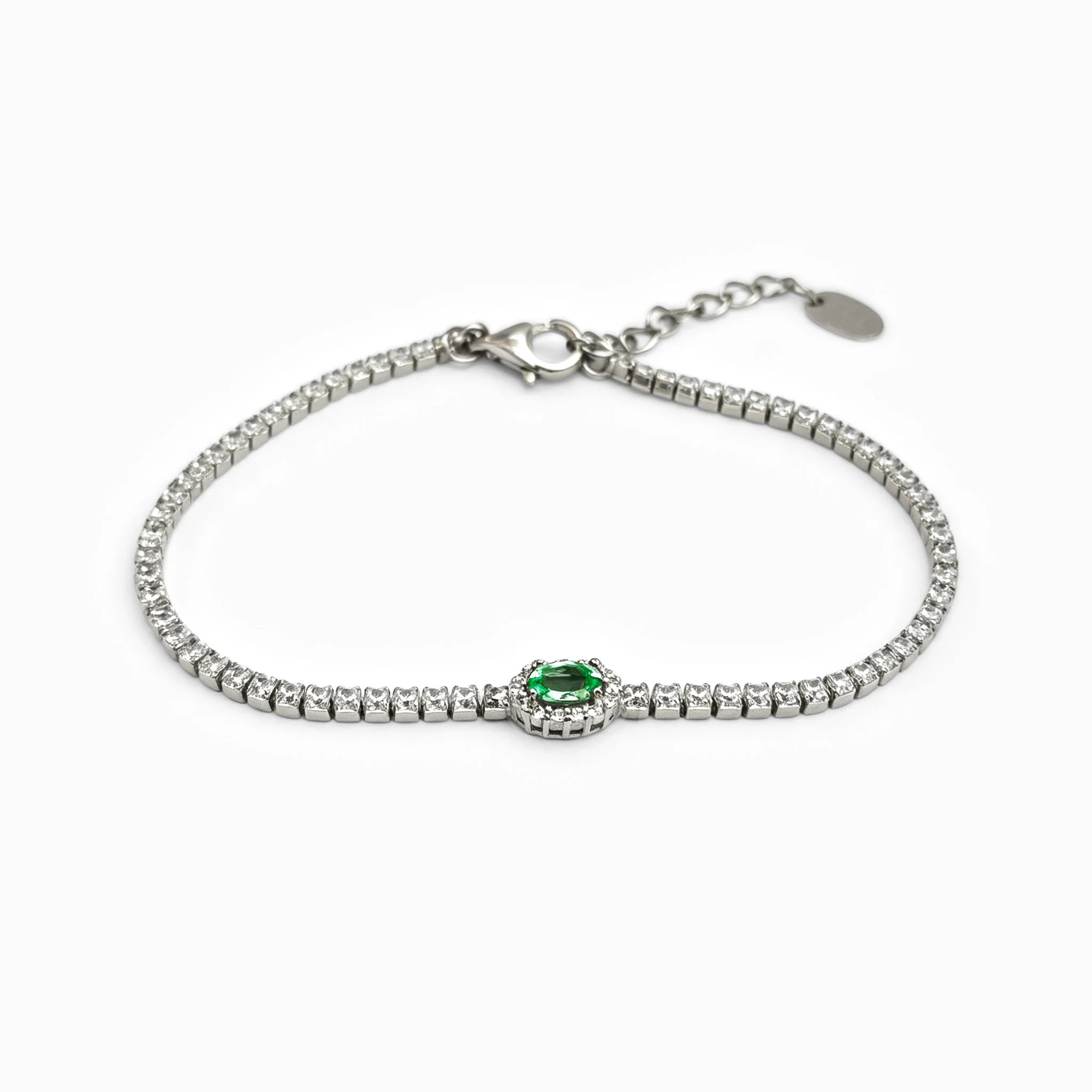 Pulsera tennis en plata ley 925 con esmeralda natural y halo de circones verdes y blancos.