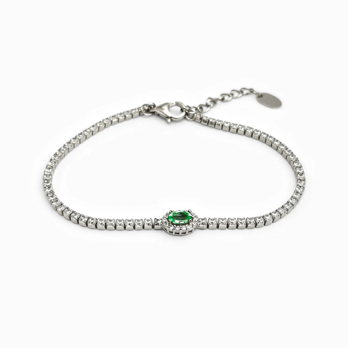 Pulsera tennis en plata ley 925 con esmeralda natural y halo de circones verdes y blancos.