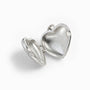 Dije relicario en forma de corazón de 18x7.5 mm en plata ley 925 con filigrana.