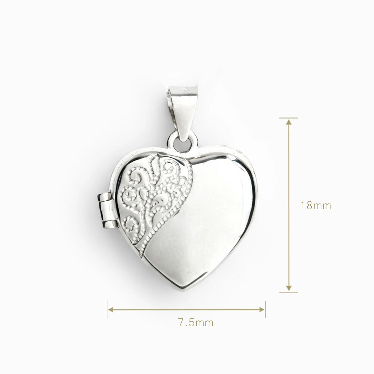 Dije relicario en forma de corazón de 18x7.5 mm en plata ley 925 con filigrana.