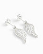 Set de aretes colgantes y dije en forma de ala celestial calada en plata ley 925 con circones.
