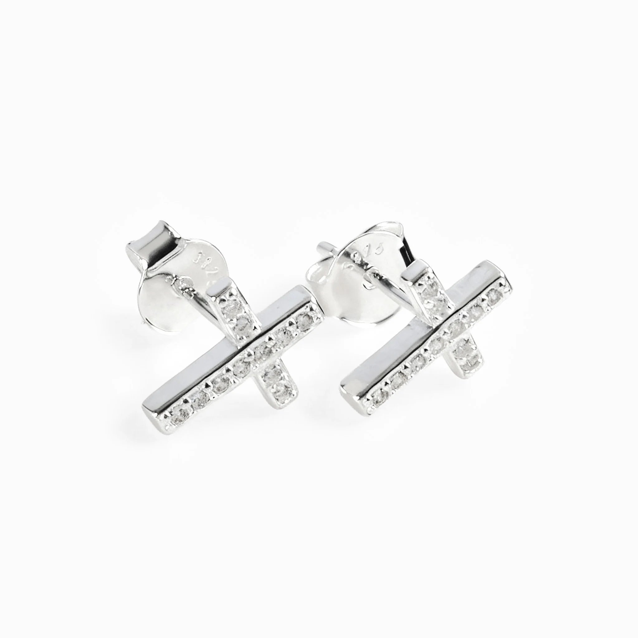 Set de topos y dije con diseño de cruz en plata ley 925 engastados con circones blancos