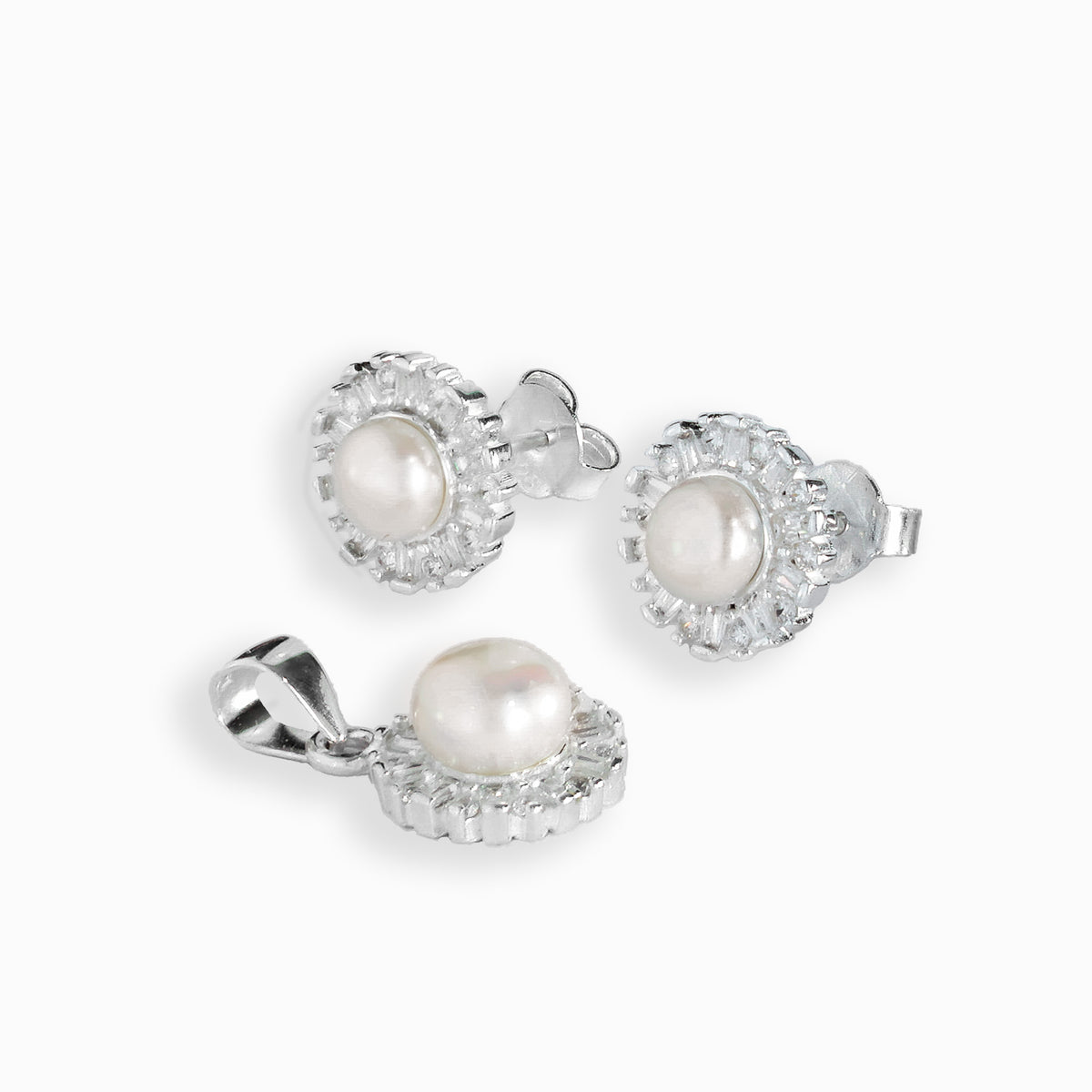 Set de topos y dije con perla central en plata ley 925.
