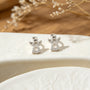 Topos miniatura con forma de ángel en plata ley 925 y circones de 8.8x7 mm