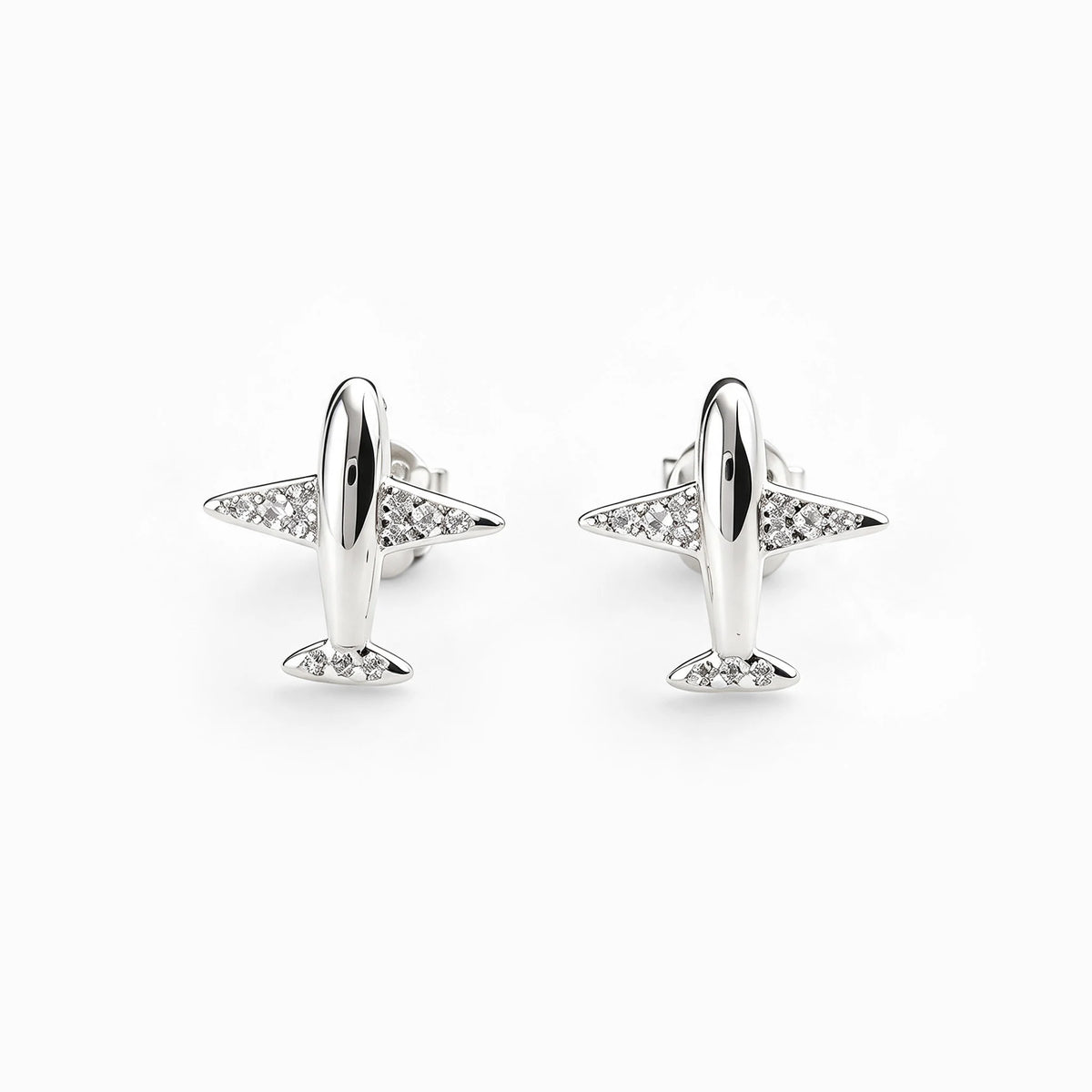 : Topos con diseño de avioncitos de 11x10 mm en plata ley 925 con circones