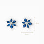 Topos florales de 8 mm en plata ley 925 con circones azules y circon blanco central