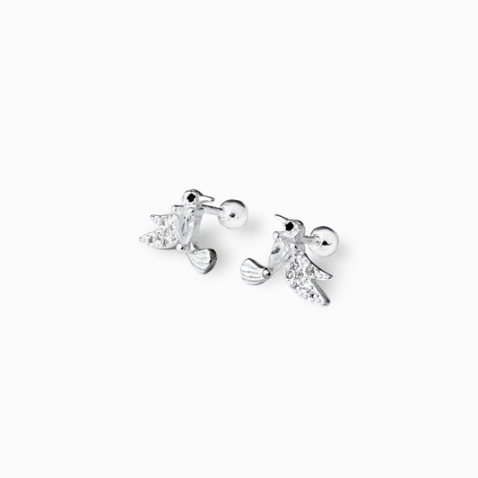  Par de aretes tipo topo con forma de pajarito y circón azul central elaborados en plata ley 925 de 9 mm sobre fondo blanco.
