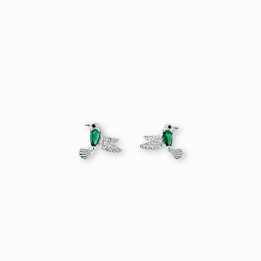  Par de aretes tipo topo con forma de pajarito y circón azul central elaborados en plata ley 925 de 9 mm sobre fondo blanco.
